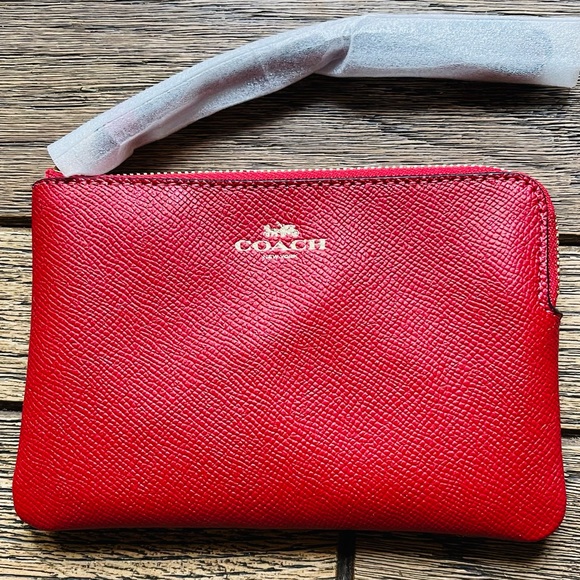 Coach Handbags - NWOT Authentic Coach wristlet.